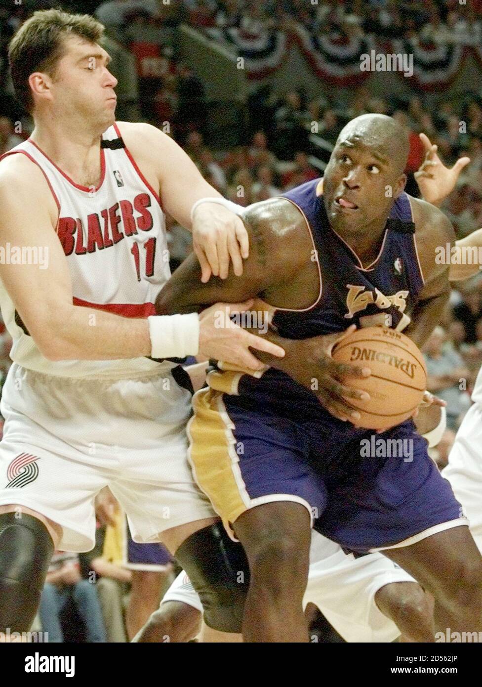 Los Angeles Lakers Shaquille O'Neal (R) goes to the hoop against Portland  Trail Blazers Arvydas Sabonis during Game 6 of the NBA Western Conference  Finals at the Rose Garden in Portland June