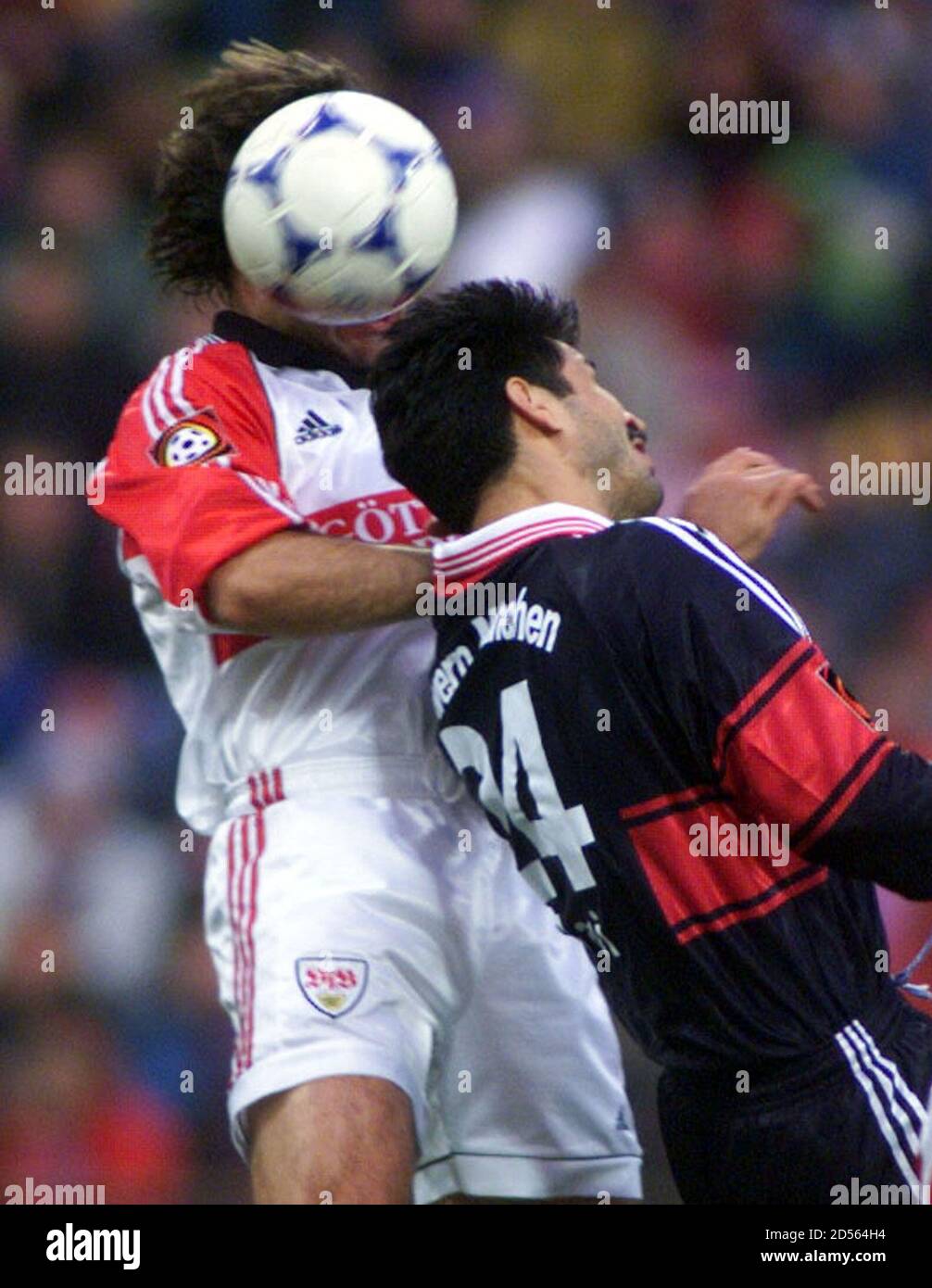 Timo Rost (L) of VFB Stuttgart heads the ball before Ali Daei of FC Bayern  Munich during the first minutes of their first division soccer match  November 14. MAD/ME Stock Photo -