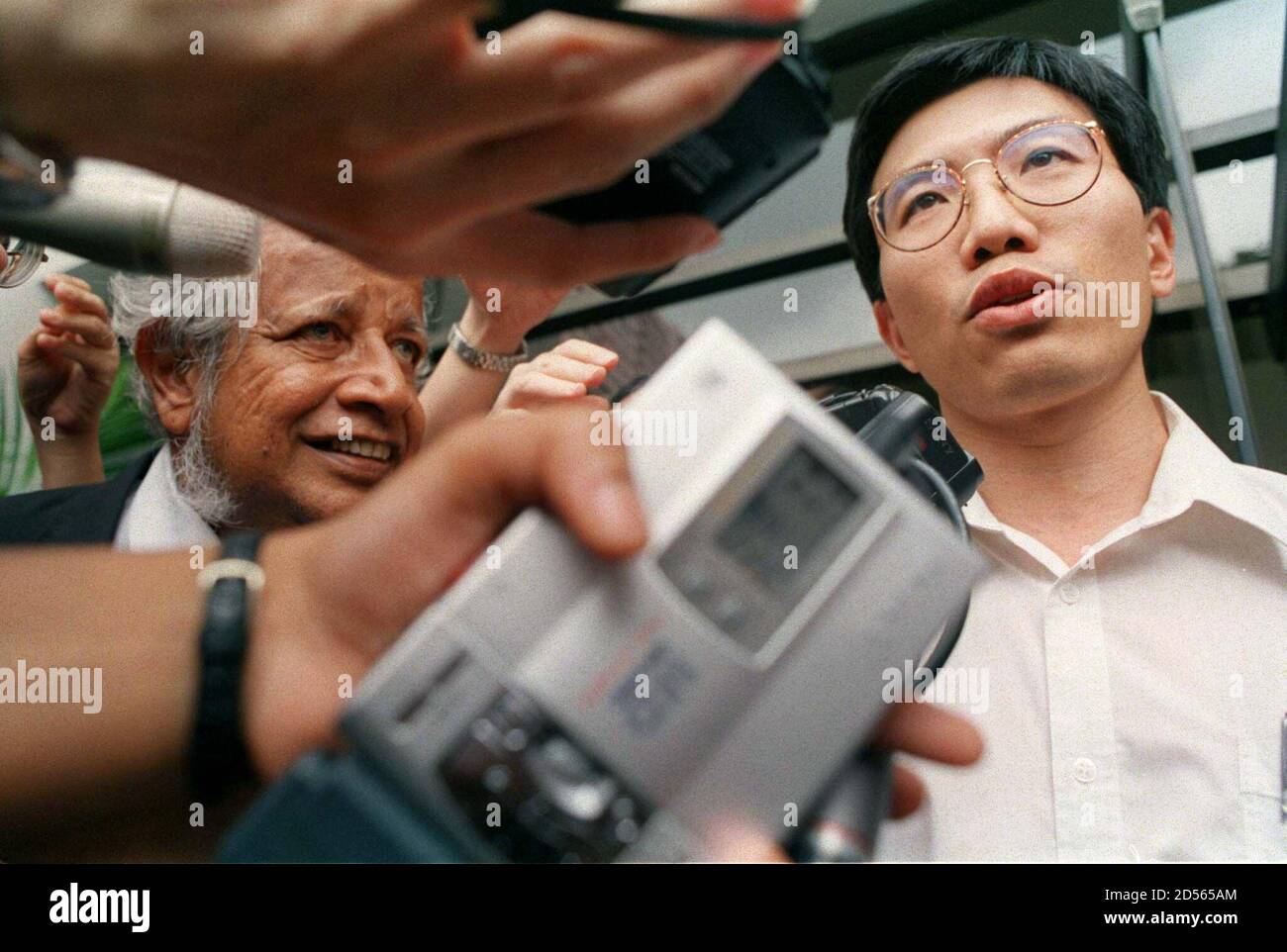 Chee Soon Juan R Leader Of The Singapore Democratic Party With His Lawyer Joshua Jeyaretnam Talks