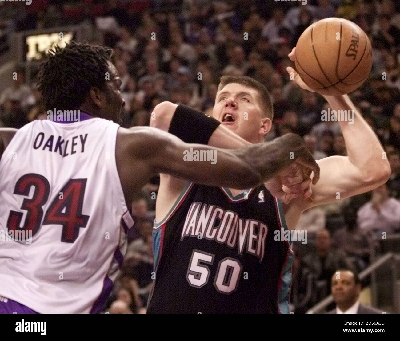 Vancouver Grizzlies center Bryant Reeves (R) loses the ball against Toronto  Raptors forward Charles Oakley during first half National Basketball  Association action at the Air Canada Centre in Toronto, January 9. The