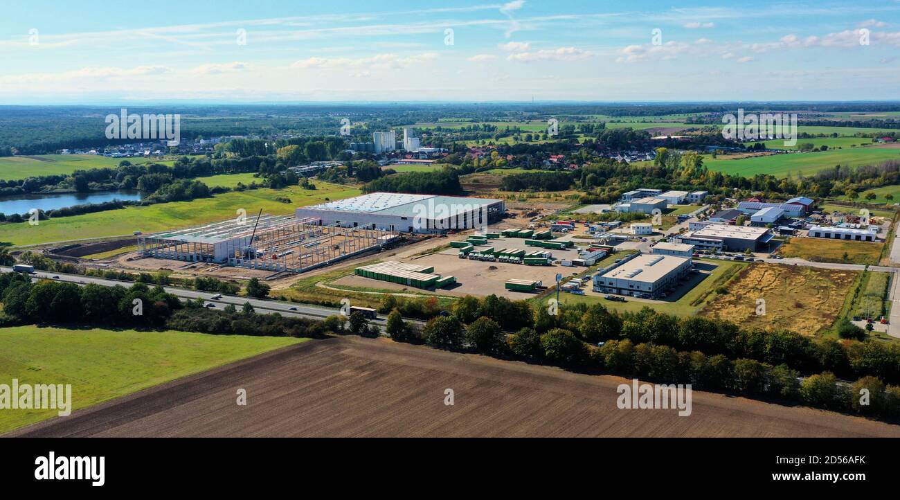 Wolfsburg, Germany, September 29., 2020: Aerial view of a new industrial area with a construction site for a hall on the outskirts Stock Photo