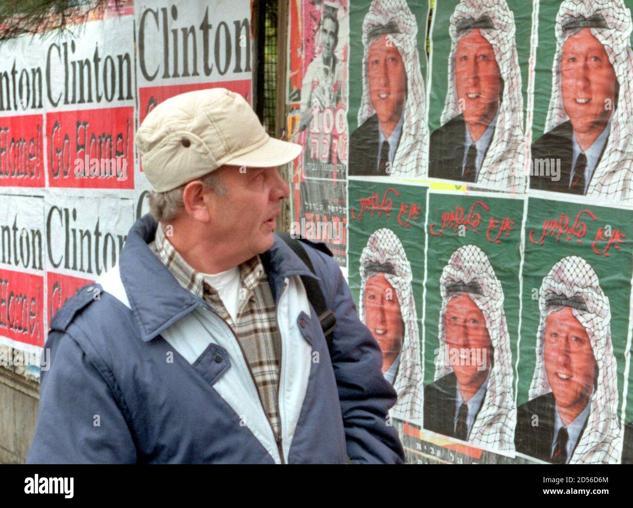 An Israeli Man Pauses To Look At Anti Clinton Posters December 10 Scores Of Which Were Pasted On Billboards All Over Downtown Jerusalem During The Night Some Of The Posters Depict U S President