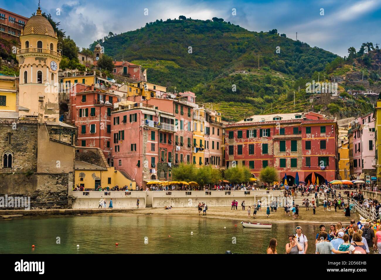 Beautiful close-up view from the port of Vernazza to the sand beach, the colourful houses and the bell tower of the Church of Santa Margherita... Stock Photo