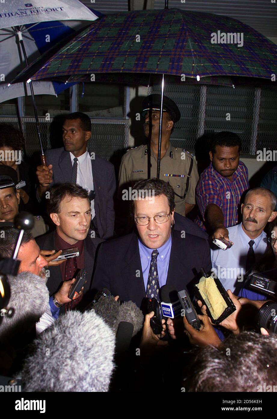 Members Of The Commonwealth Ministerial Action Group Alexander Downer C Australia S Minister Of Foreign Affairs And His New Zealand Counterpart Phil Goff L Speak To The Media At Suva Airport June 16