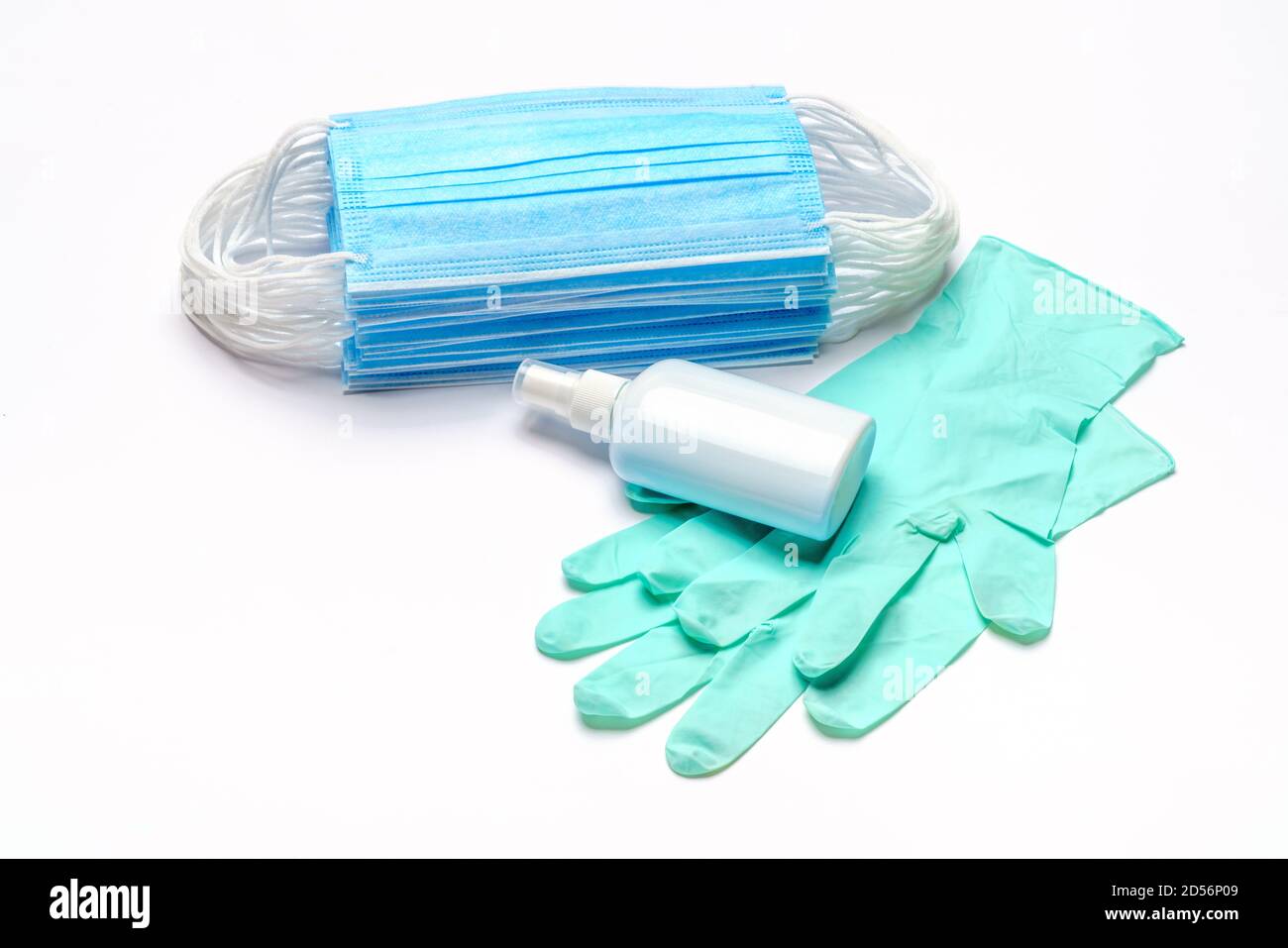 Disposable blue medical face mask, rubber latex gloves and alcohol hand