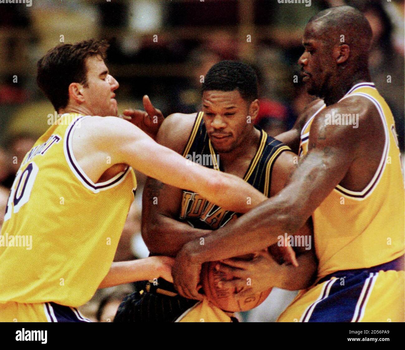 The Indiana Pacers Antonio Davis (C) fights for the rebound with the Los  Angeles Lakers Travis Knight (L) and Shaquille O'Neal in the first period  of their NBA game in Inglewood February