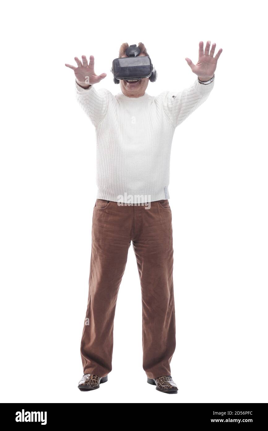 smiling man looking through virtual reality glasses. isolated on a white Stock Photo