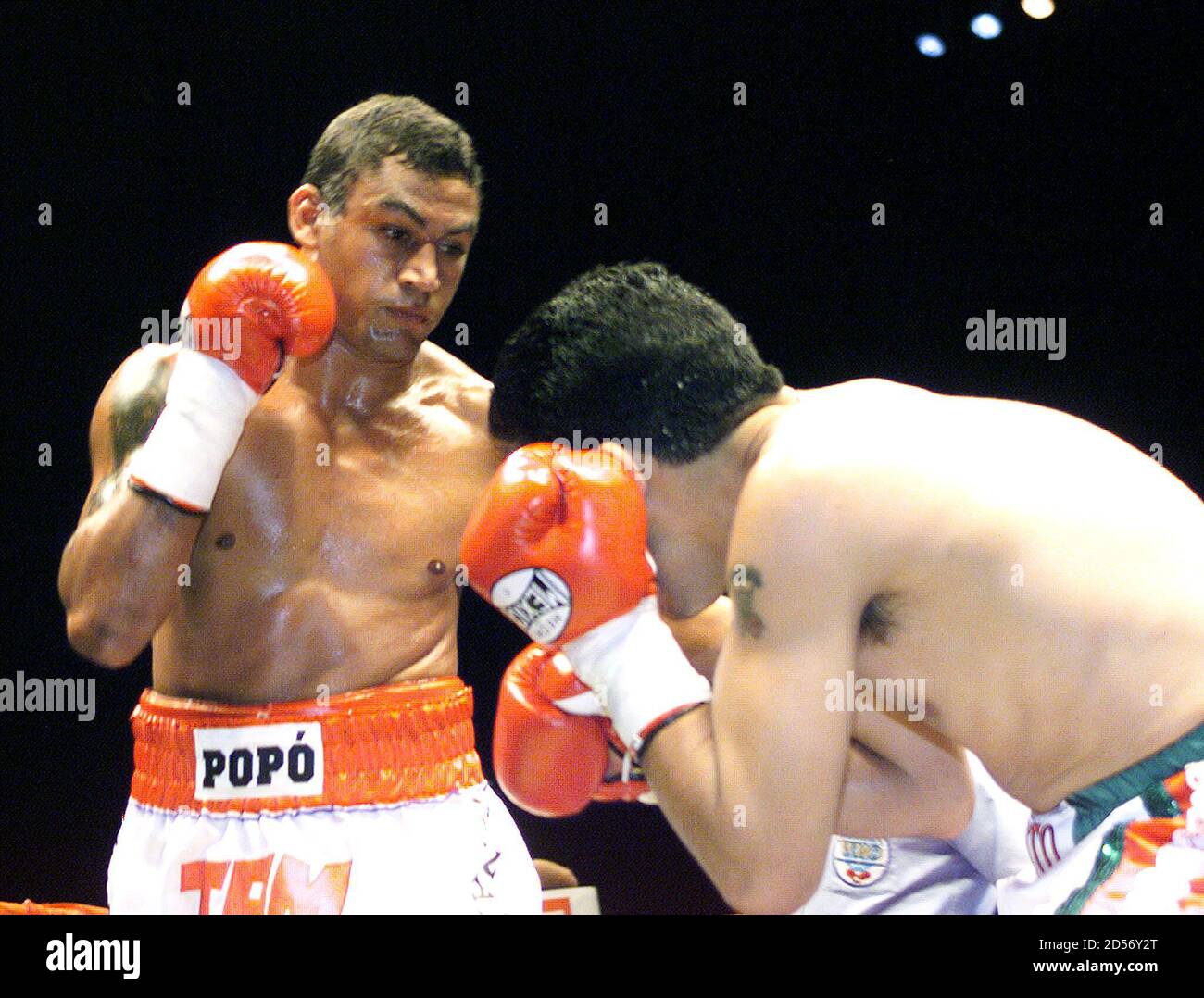 Champion Acelino Popo de Freitas (L) connects with a left punch to Mexican  challenger Javier Jauregui during the (WBO) World Organization of Box super  feather weight title bout in Sao Paulo late