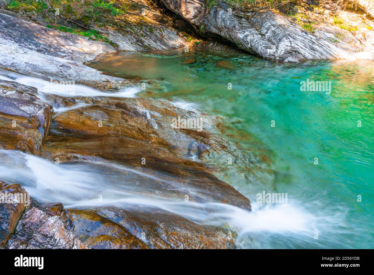Emerald valley, a peaceful mountain valley with turquoise water creek and small waterfalls in Yellow mountain, Anhui province, China. Stock Photo