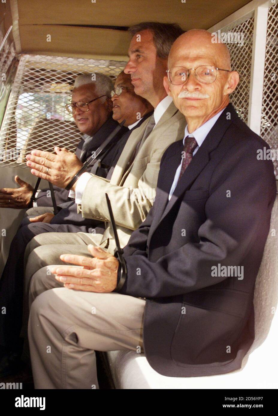Ed Harris, a retired pastor from Salem, Virginia (R,) sits with others arrested in a paddy wagon after they were arrested for unlawful assembly, June 14, outside the Orange County Convention Center where the Southern Baptist Convention is taking place. They were demonstrating with the group Soulforce, which is protesting the nation's largest Protestant group's discriminatory policies.  Members of the Convention approved a statement of belief which condemns homosexuality. Stock Photo