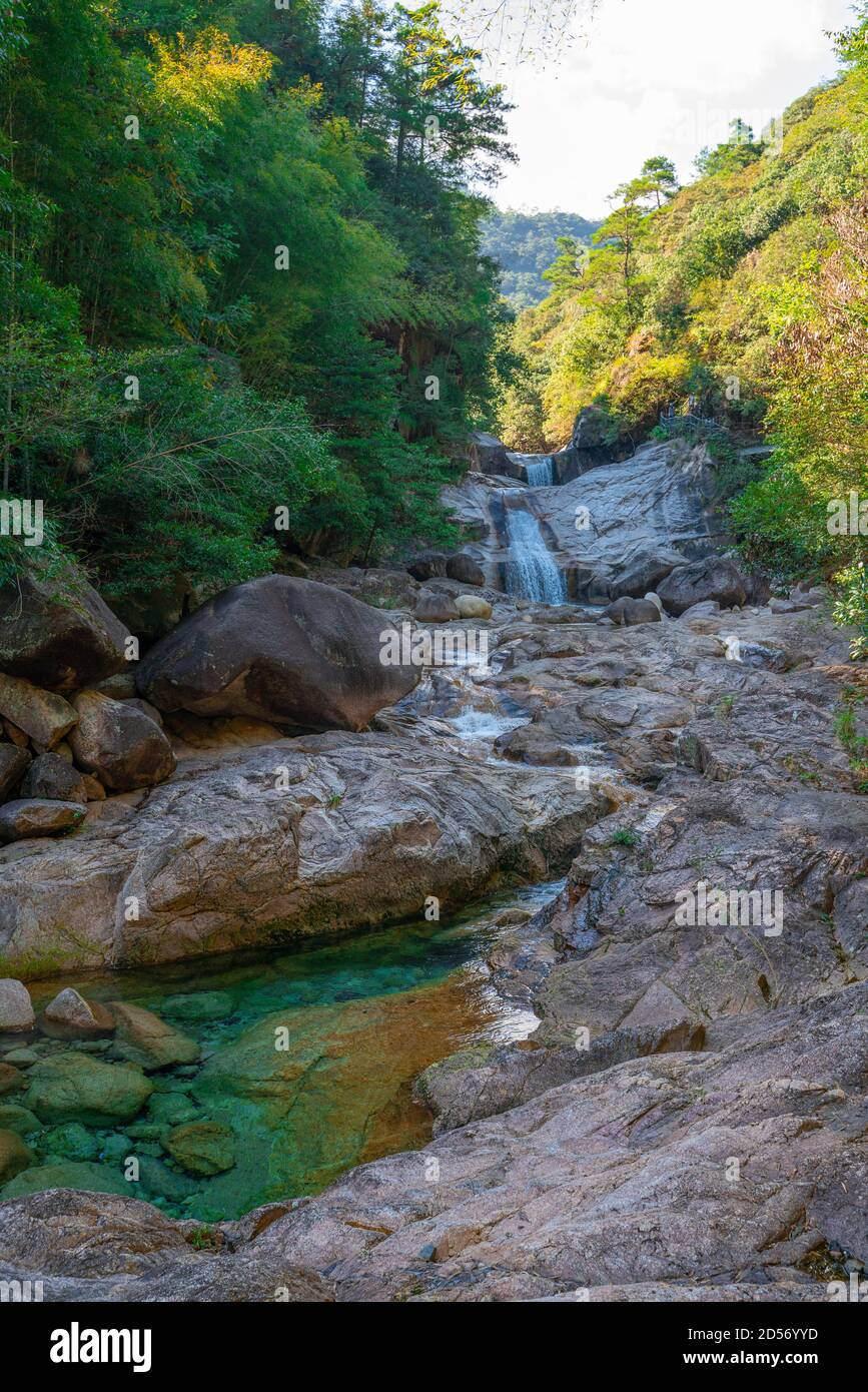 Emerald valley, a peaceful mountain valley with turquoise water creek and small waterfalls in Yellow mountain, Anhui province, China. Stock Photo