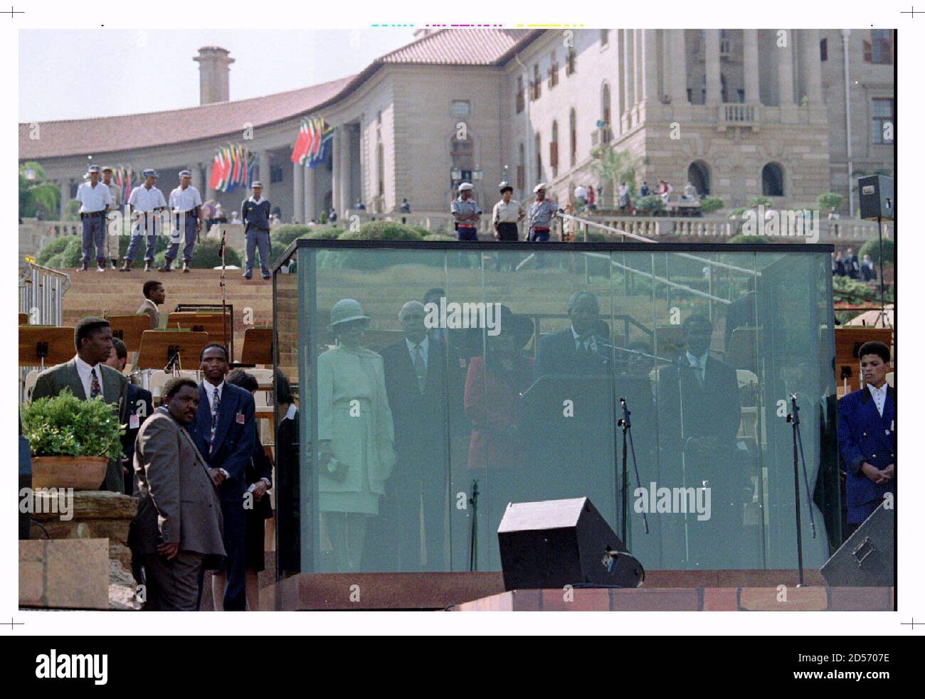 President Nelson Mandela Flanked By Second Deputy President F W De Clerck L And First Deputy President Thabo Mbeki R Addresses The Crowd From Behind Bullet Proof Glass In Front Of The Union Building