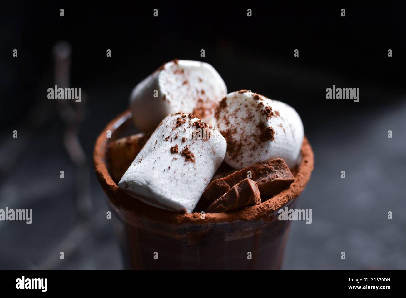 Glass cup of Hot chocolate with marshmallows in knitted cup holder with  cookies, chopping chocolate and mittens over wooden wind Stock Photo - Alamy