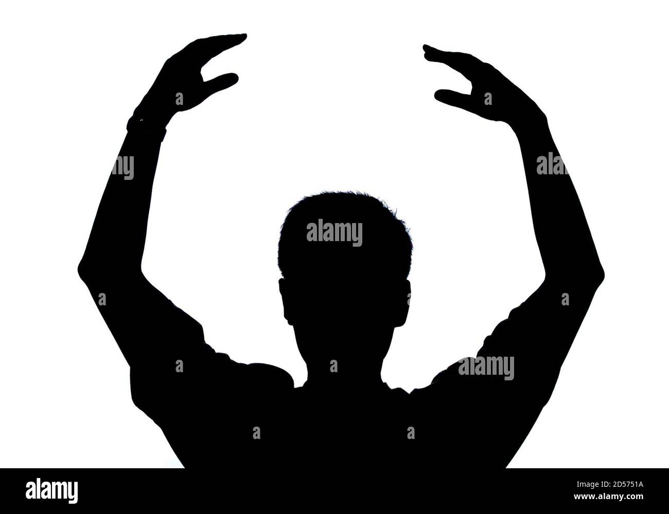 A member of the banned Falun Gong is silhouetted as he performs breathing exercises at a private place in Beijing August 8. China, waging a war of words against the spiritual movement that claims 100 million members, labelled it a very dangerous cult on Tuesday. China outlawed Falun Gong on July 22, calling it an illegal organisation that corrupted the people's minds and sabotaged stability. A large number of Falun Gong members are continuing to practise at private places despite the government ban. ASW/CC Stock Photo