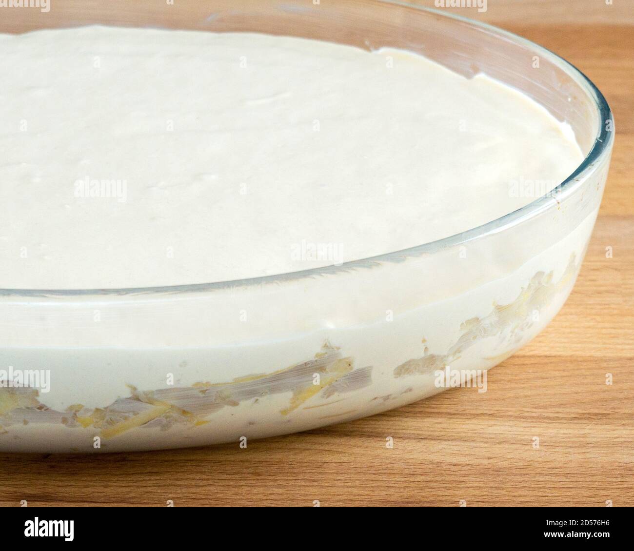 Raw pie with dough and meat filling on the table. No people. Stock Photo