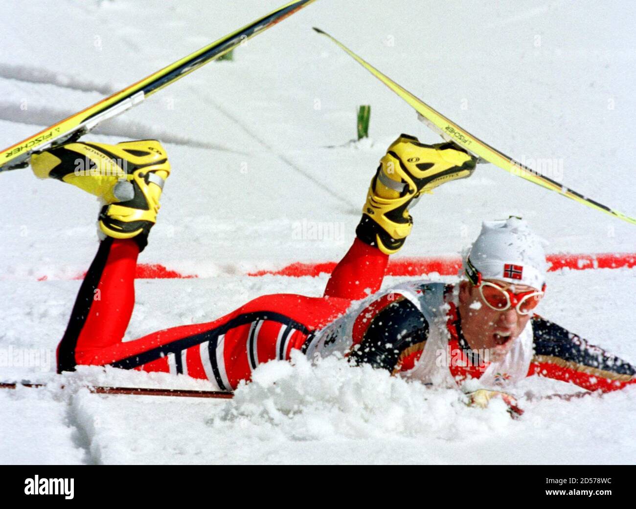 Norway's Bjoern Daehlie lies in the snow after crossing the finish line to  win his third Nagano Olympic gold medal in the men's Olympic 50 km  cross-country freestyle race February 22. Daehlie,