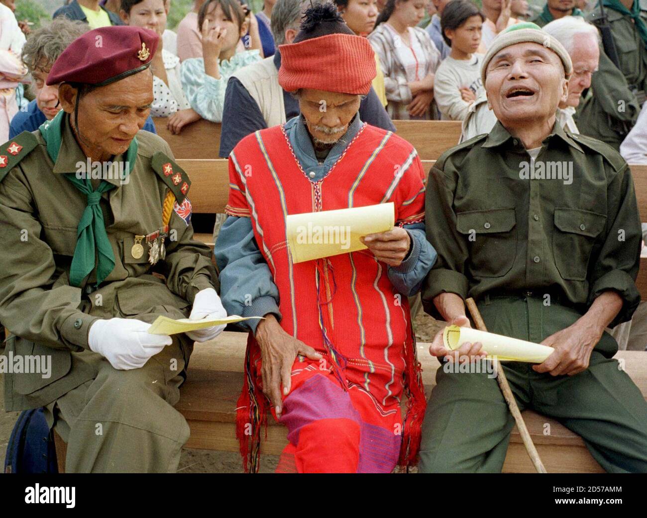 Veterans of the Karen National Union (KNU) read a certificate given to them during celebrations marking the KNU's 50th year of fighting for an autonomous state in the military base of Tadoh Thutan on the bank of the Moei river in eastern Myanmar January 31. The KNU is one of the only ethnic groups in Myanmar that has not entered into a cease-fire agreement with the SPDC (State Peace and Development Council, formerly SLORC) the military regime in Yangon the capital. Stock Photo