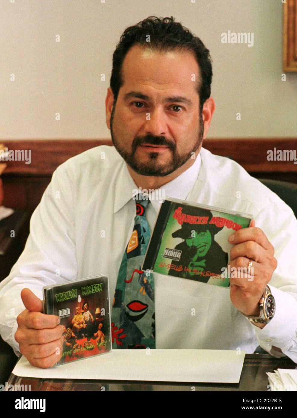 Attorney Paul J. Cambria Jr., spokesman and counsel for shock-rock musician 'Marilyn Manson' holds two recent CD's April 21 in Buffalo, NY, as he disclaims any connection between the singer and the high school shootings in Littleton, CO. The shooting suspects reportedly talked about the music of 'Marilyn Manson', a stage name for singer Brian Warner derived from Marilyn Monroe and  Charles Manson. Stock Photo