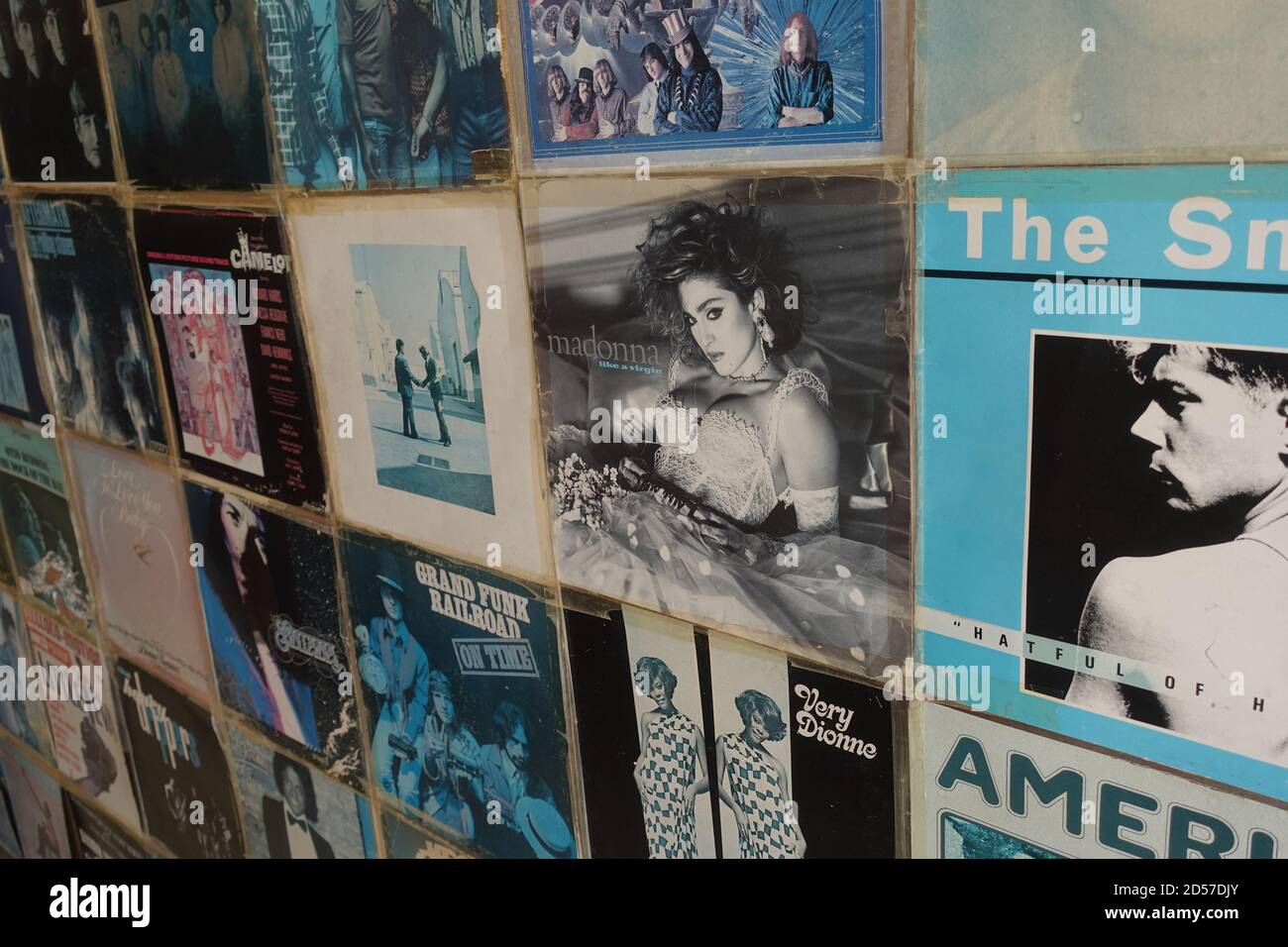 Athens, Greece - August 7, 2019: Wall with vintage pop rock music vinyl record albums from the 1970s and 1980s. Stock Photo