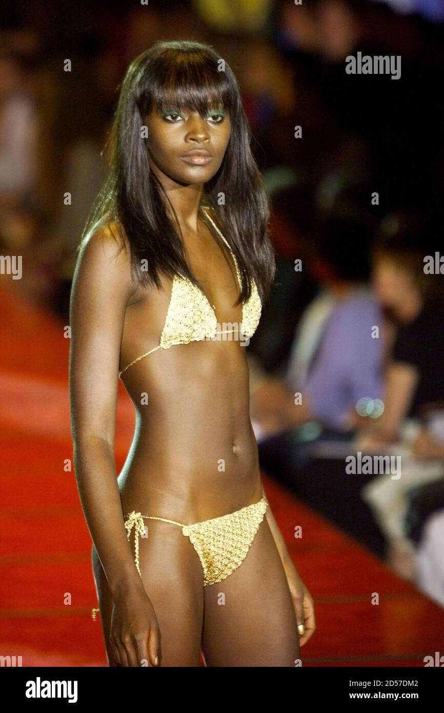 A model wears a gold crochet string bikini as she walks the runway at the  Versus by Versace fashion show in New York, September 12. Versace helped  kick-off New York's fashion week