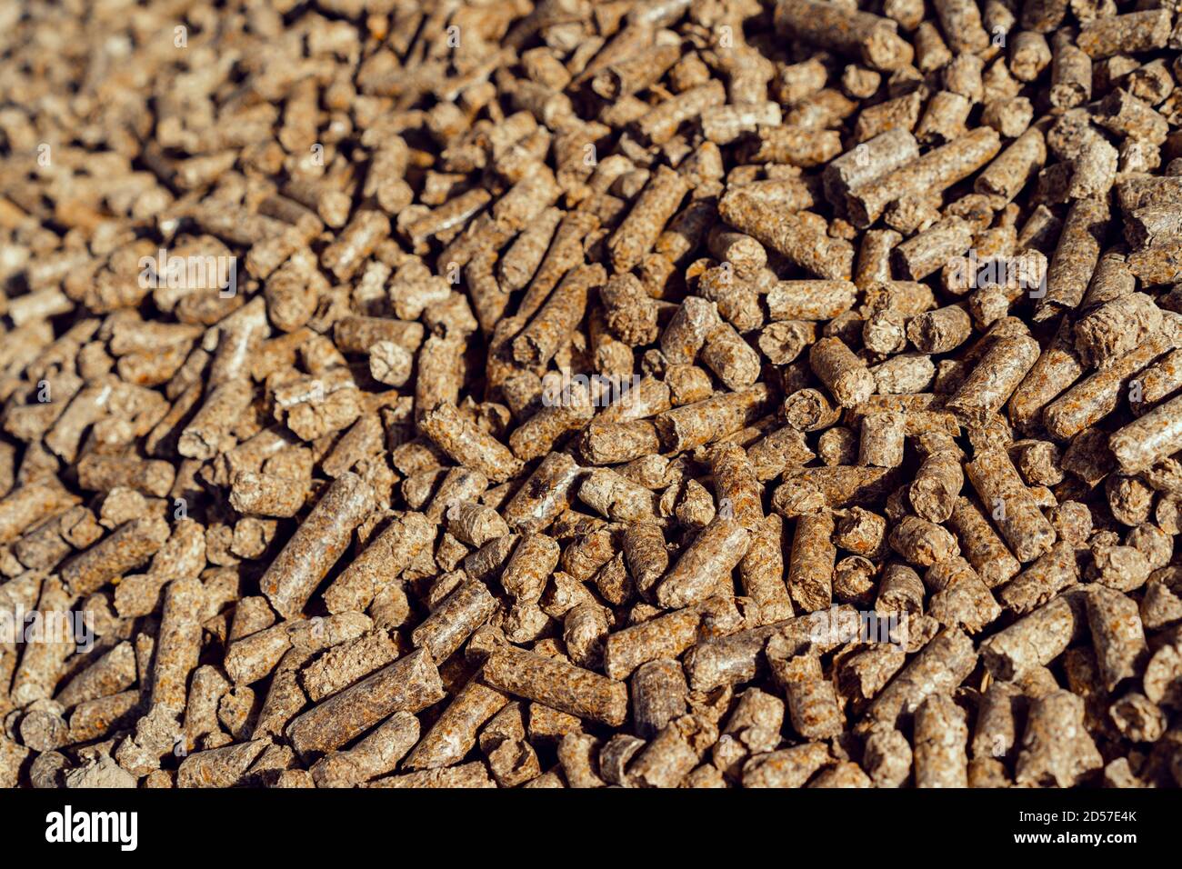 Large pile of compressed eco wood pellets Stock Photo - Alamy