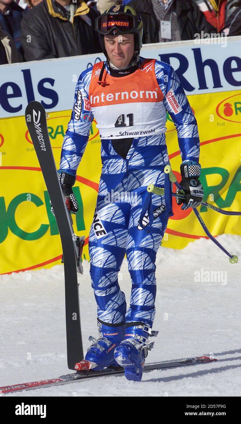 France's Vincent Millet carries his broken ski in the finish area of the  men's giant slalom World Cup race on the hills of the Black Forrest  February 5. Millet broke the ski