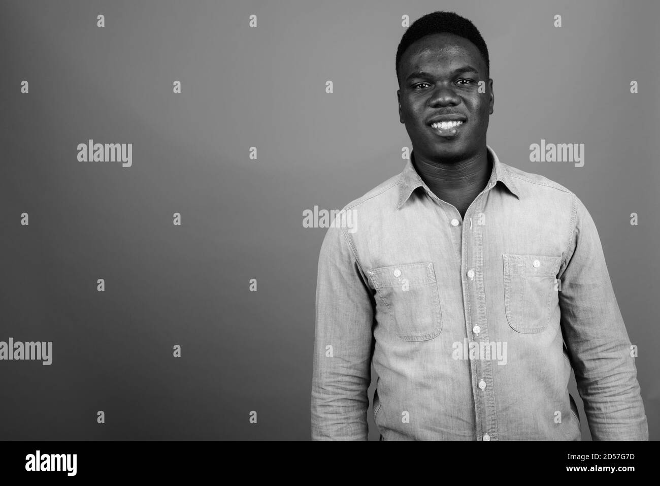 Happy young African man wearing denim shirt Stock Photo