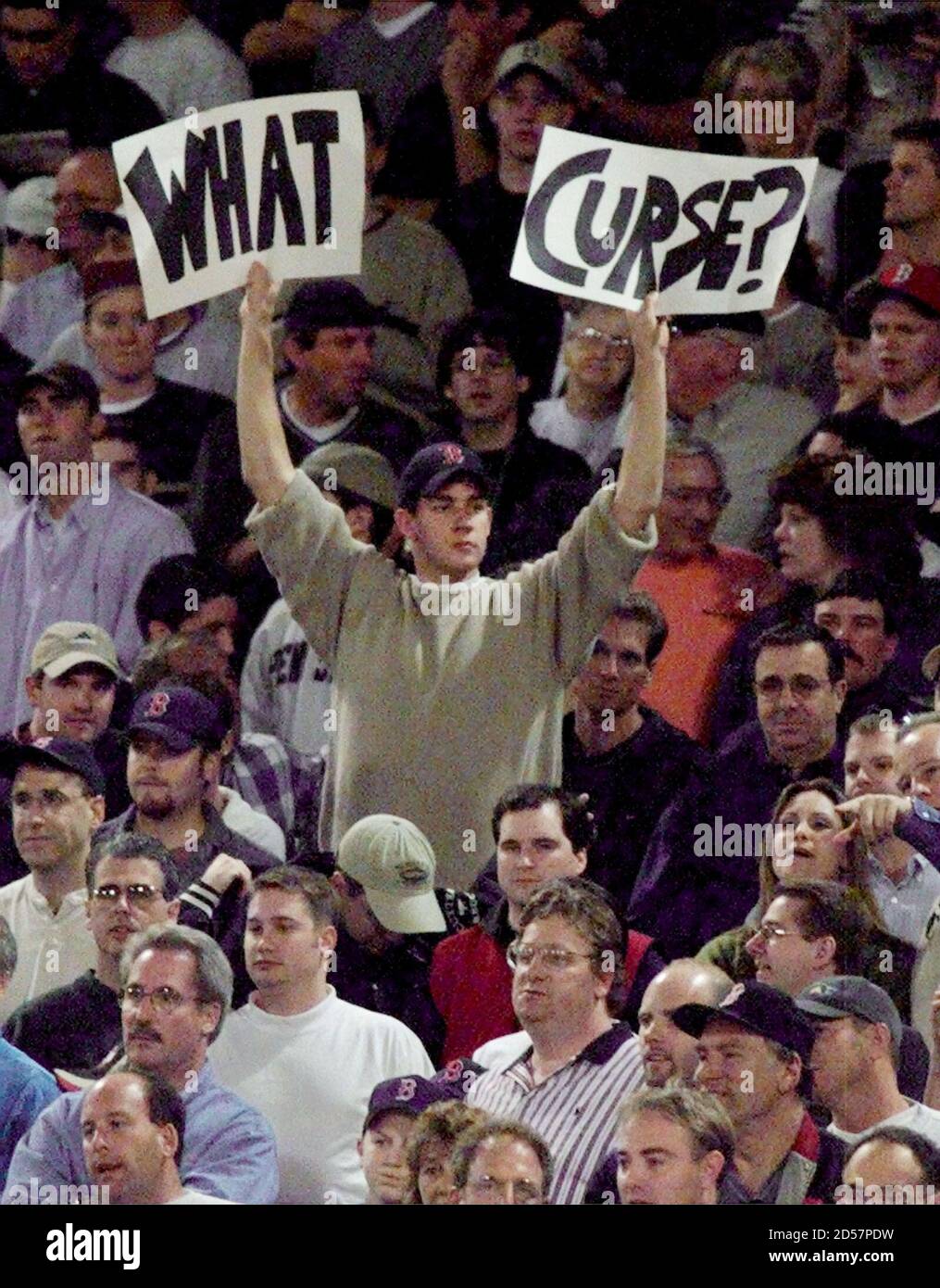 A Boston Red Sox fan holds a sign reading "What Curse?" as the Red Sox  avoided elimination in Game 3 of their American League Division Series with  a 9-3 defeat of the
