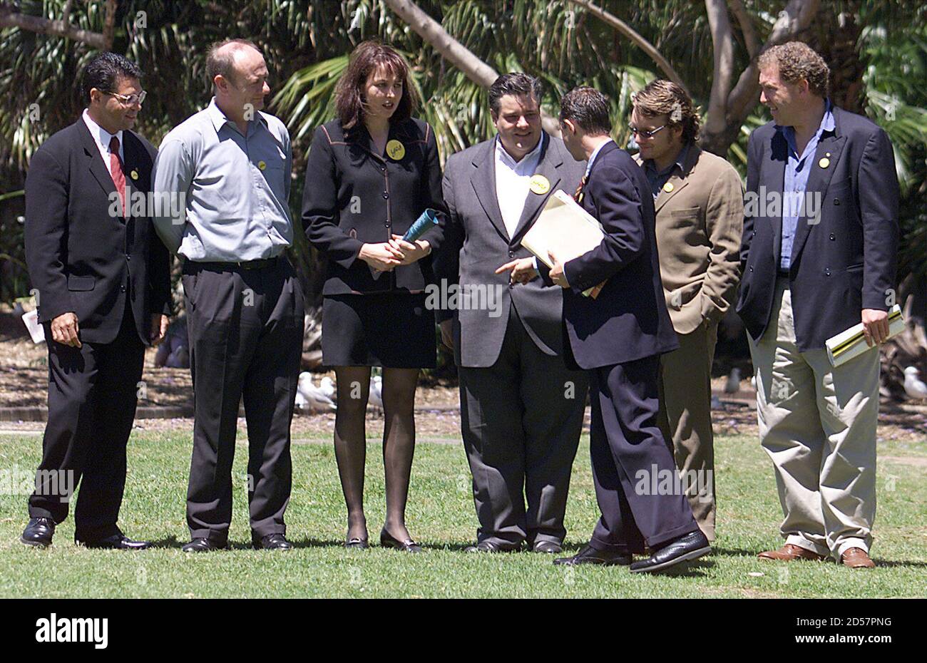 An advisor positions (L-R) Aboriginal Senator Aden Ridgeway, Reverend Tim Costello, Australian netball captaion Liz Ellis, comedian Mikey Robbins, actor Jeremy Sims and showbusiness entrepreneur Steve Vizard for a group photo after they held a media briefing to launch the Yes Ambassadors for the Republic at Sydney's First Fleet Park October 28. The group, which represents more than 300 celebraties, sports stars and other famous Australians, told journalists it was important for Australians to know that many of their fellow citizens, some of who have represented their nation overseas and have a Stock Photo
