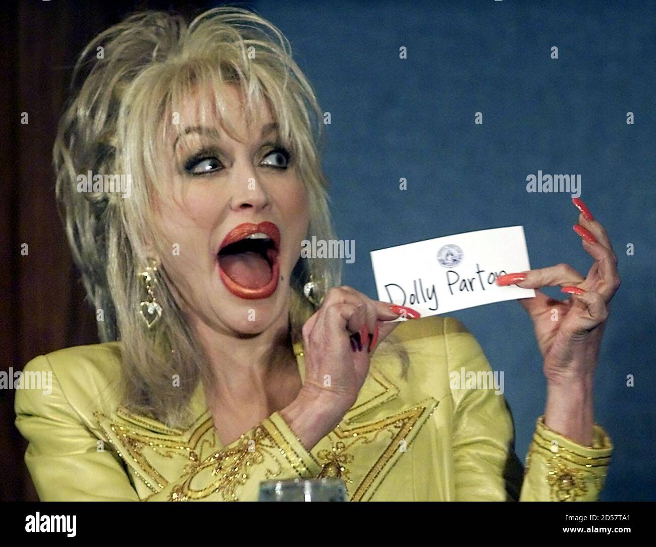 Country Music star Dolly Parton jokes with members of the National Press  Club prior to her remarks March 23. Parton appeared at the press club to  help promote her literacy advocacy group,