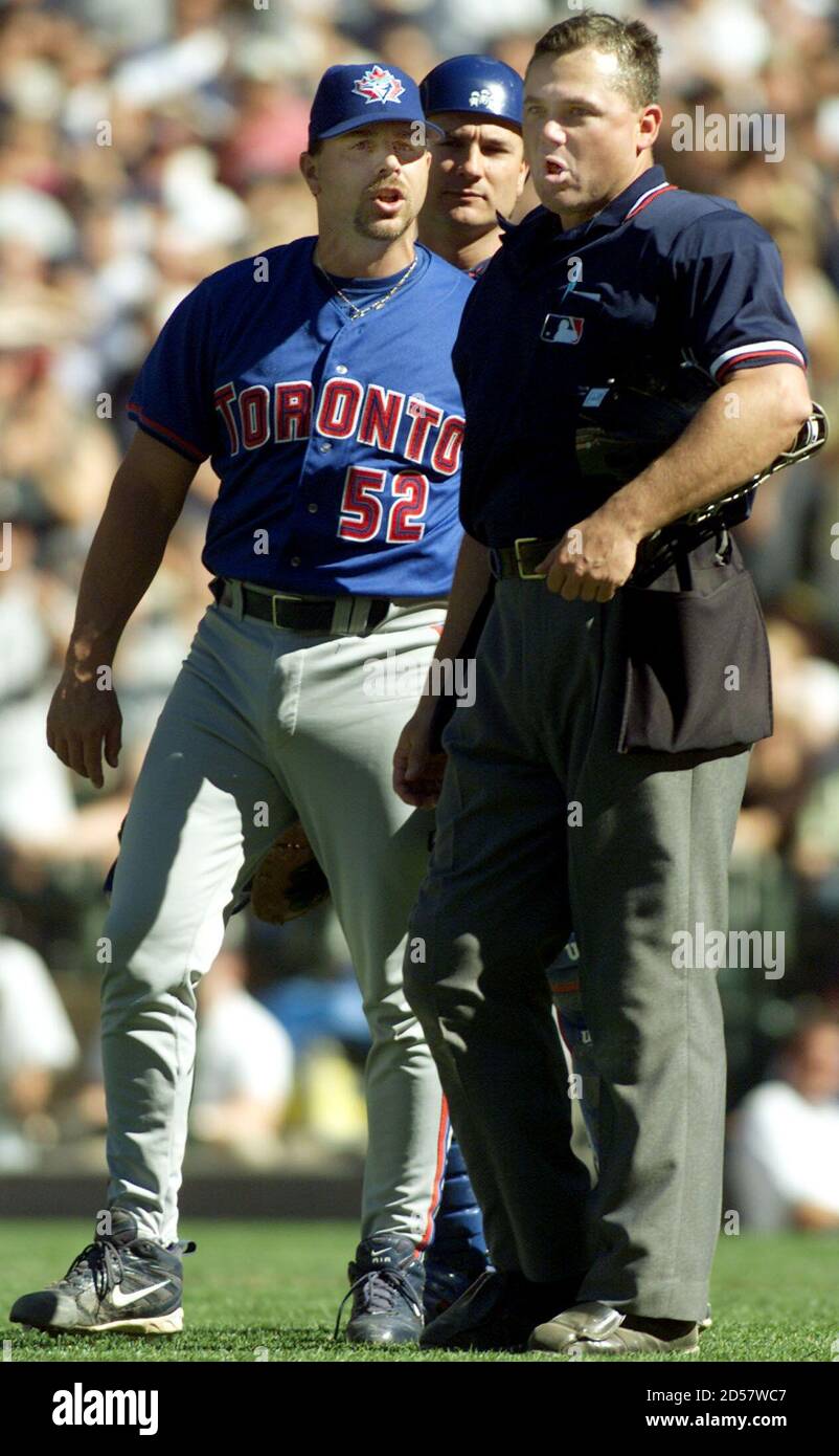 The Toronto Blue Jays relief pitcher John Frascatore (L) yells at umpire  Rich Rieker (R) after Rieker ejected him for pitching too-close to Seattle  Mariner batter Alex Rodriguez during the eighth inning
