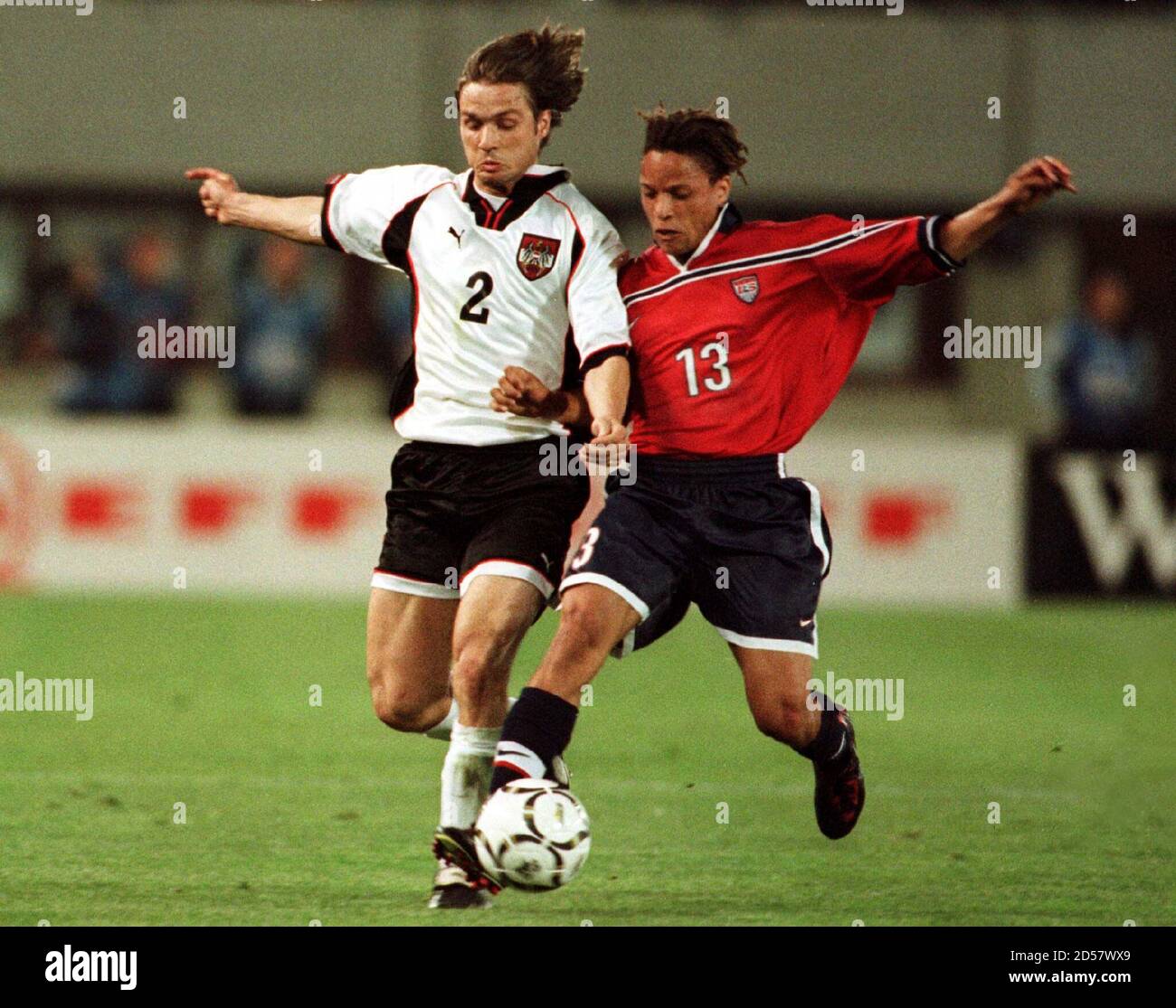 Austria's Harald Cerny (L) and Cobi Jones of the USA fight for the ball during their soccer friendly in Vienna April 22.  REUTERS Stock Photo