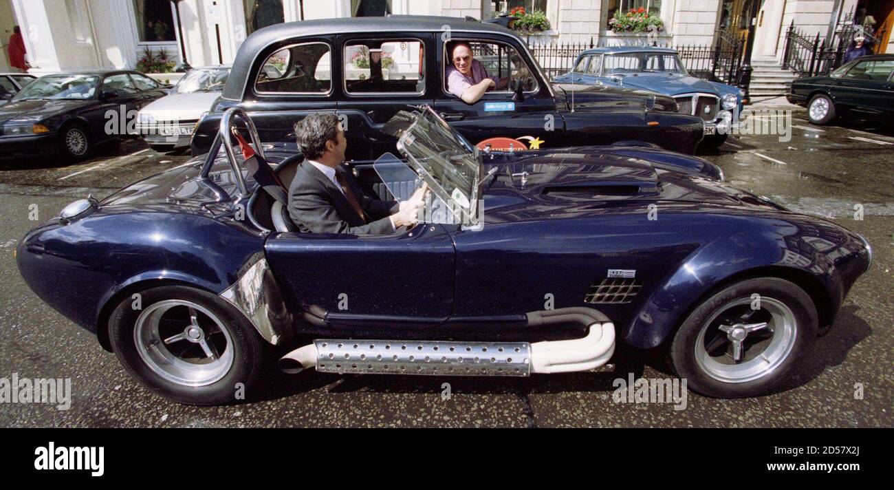 A Christie S Employee Driving A 1967 Ac Cobra 427 Mk Iii Pulls Up Along Side A London Taxi June 3 The Cobra One Of The Most Powerful Road Going Open Sports Cars Ever