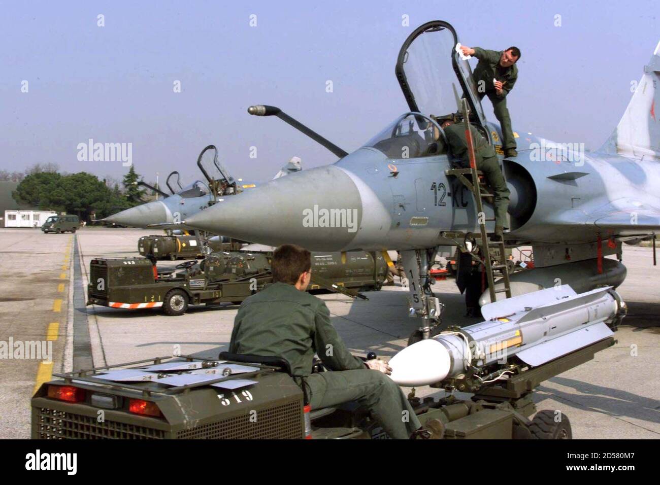 French soldiers load an air to air missile on a Mirage 2000c at NATO air  base of Istrana, Italy, April 2. Members of the French army are deployed to  Istrana Air Base