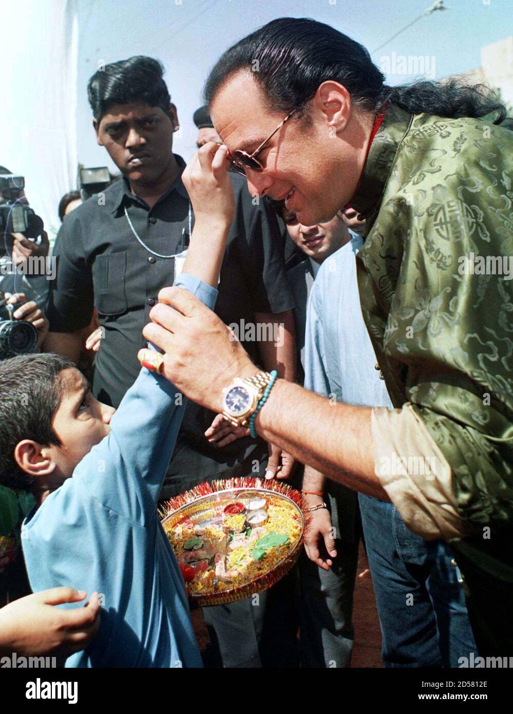 Hollywood action star Steven Seagal receives a welcome from a child at a  home for destitute and street children in New Delhi on April 27. The home,  run by an non-governmental organization,