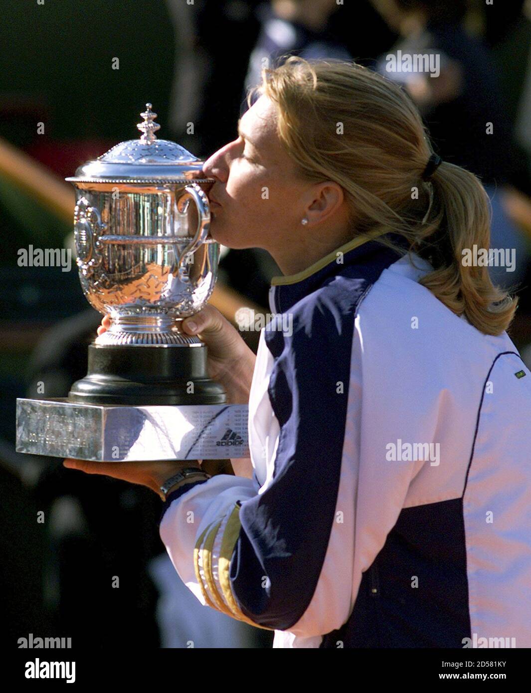 Steffi Graf of Germany kisses her trophy after her victory against Martina  Hingis of Switzerland in
