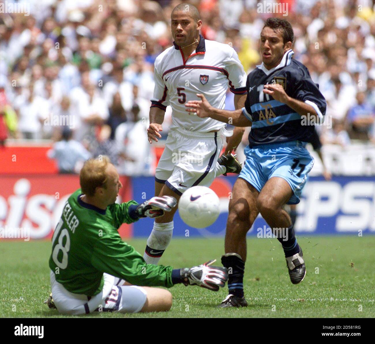 U S National Soccer Team Goalkeeper Kasey Keller L Blocks A Drive On The Goal By Argentine Striker Gustavo Lopez As U S Defense C J Brown C Looks On During A Friendly Match In U S National Soccer Team Goalkeeper Kasey Keller L Blocks A Drive On The Goal By Argentine Striker Gustavo Lopez As U S Defense C J Brown C Looks On During A Friendly Match In