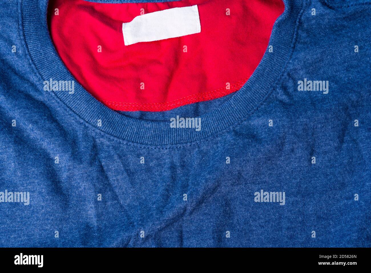 Dark blue plain cotton t-shirt. a stylish shirt with a round collar and red lining. Stock Photo