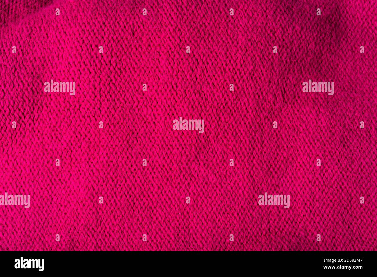 Red woolen texture, bay be used as background. Red fabric texture. Stock Photo
