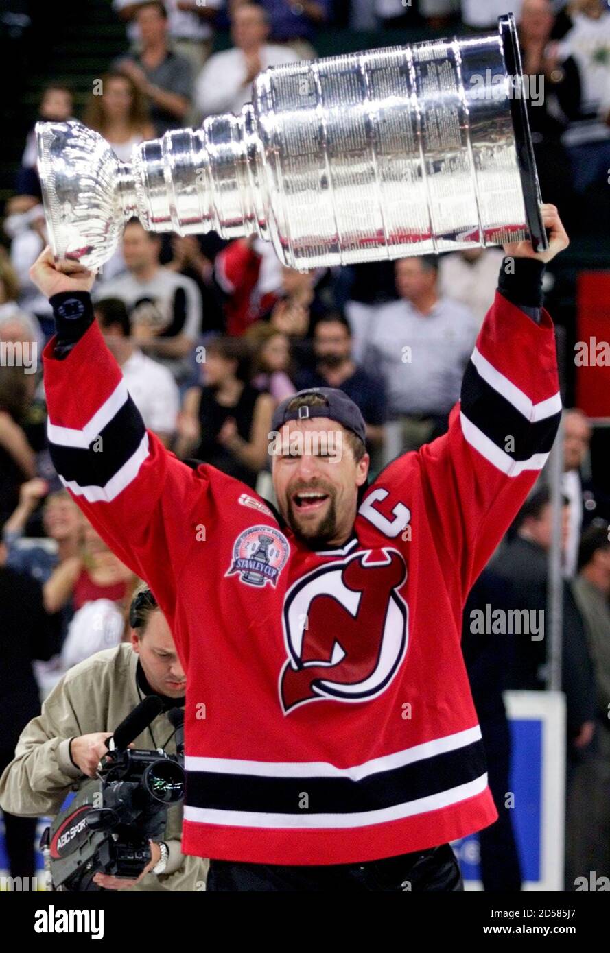 New Jersey Devils' defenseman Scott Stevens holds the Stanley Cup after the  Devils defeated the Dallas Stars 2-1 in overtime at Reunion Arena, June 10.  Stevens was also named the winner of