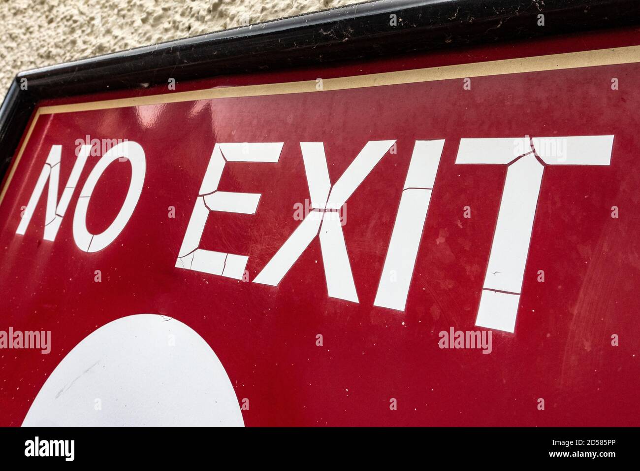 White words No Exit sign on red background on wall Stock Photo - Alamy