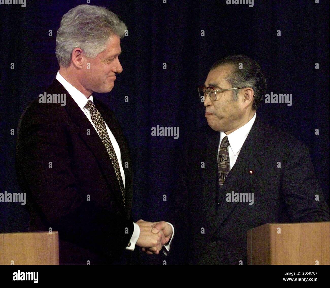 President Clinton and Japanese Prime Minister Keizo Obuchi shake hands  following their joint statement in Tokyo's Akasaka Palace at the end of  Clinton's two-day visit to Japan November 20. They discussed each