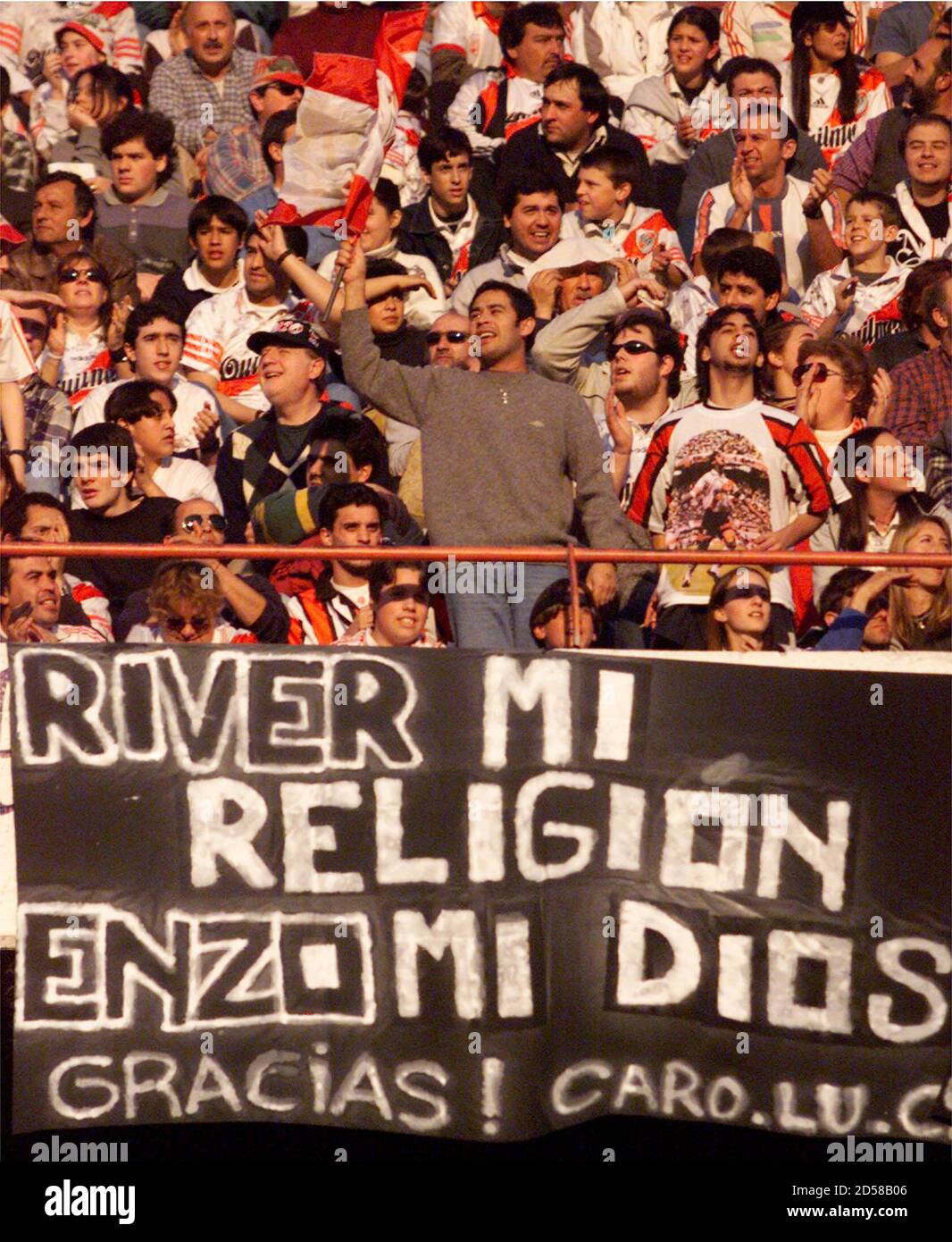 Fans Of The Last Idol Of Argentine Soccer Club River Plate Uruguayan Striker Enzo Francescoli Cheer In Front Of A Banner Saying My Religion Is River Plate Enzo Is My God During