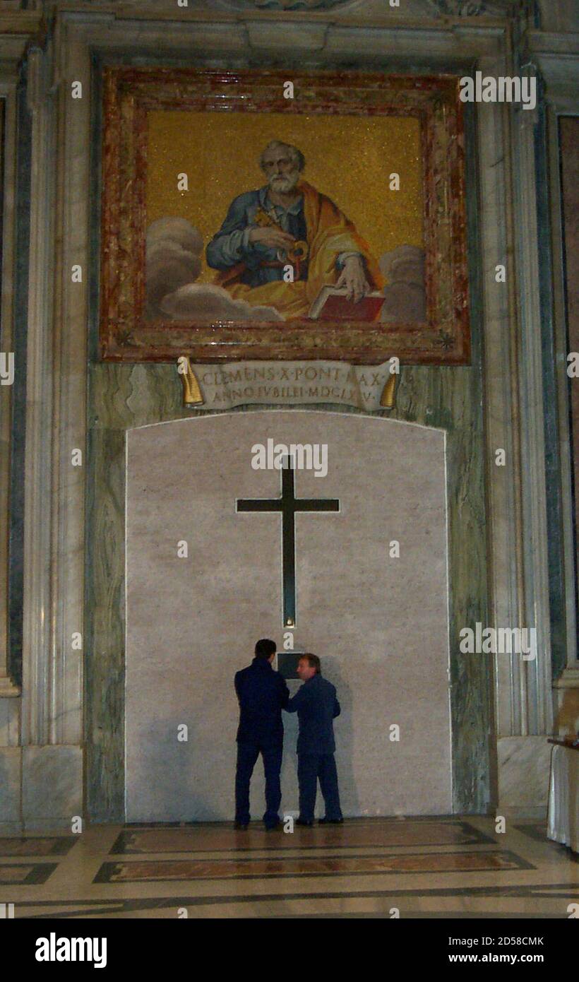 Workmen Begin To Chip Away Part Of The Cement Which Covers One Side Of The Holy Door In St Peter S Basilica December 15 During A Brief Ceremony Pope John Paul Ii Will