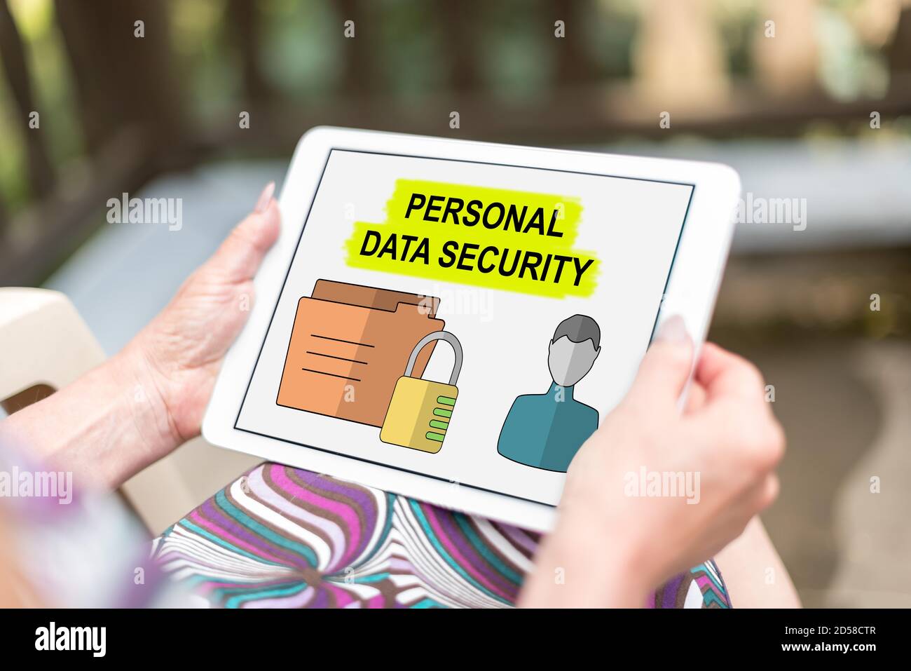 Personal data security concept shown on a tablet held by a woman Stock Photo