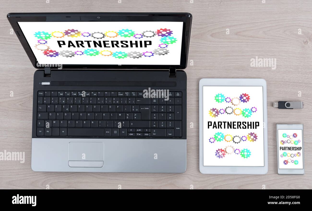 Partnership concept shown on different information technology devices Stock Photo