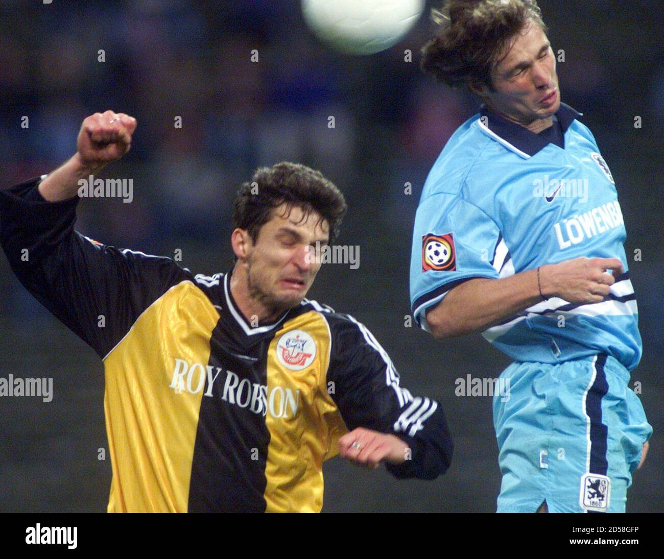 Stefan Malz Of Tsv 1860 Munich And Hilmar Weilandt Of Fc Hansa Rostock Fight For The Ball In Munichs Olympic Stadium Stefan Malz Of Tsv 1860 Munich R And Hilmar Weilandt Of