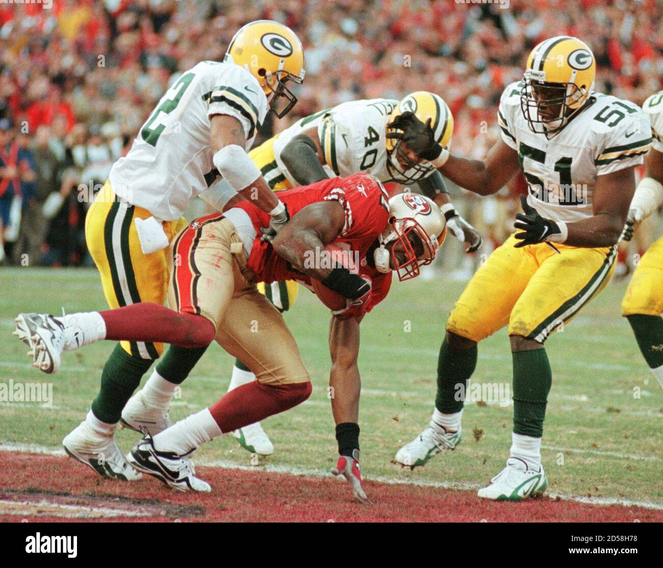 San Francisco 49ers Terrell Owen (C) catches the game winning touchdown  pass between Green Bay Packers Darren Sharper (L) Pat Terrell (40) and  Brian Williams (51) with three seconds left in their
