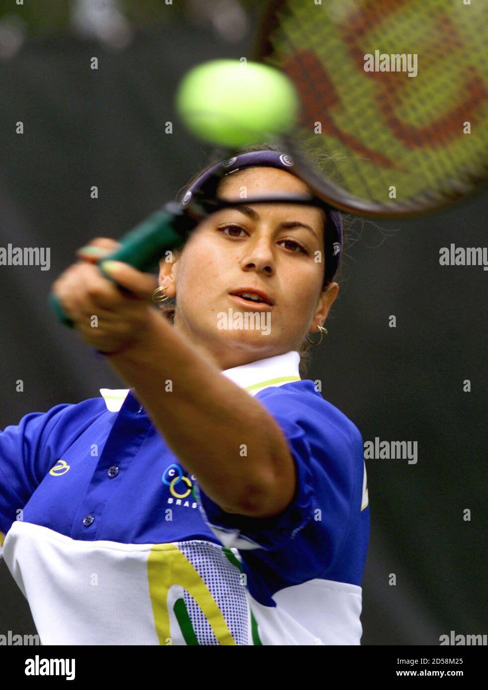 Joana Santos Of Brazil Returns A Shot During Her Match Against Vales Cordoba Of Cuba At