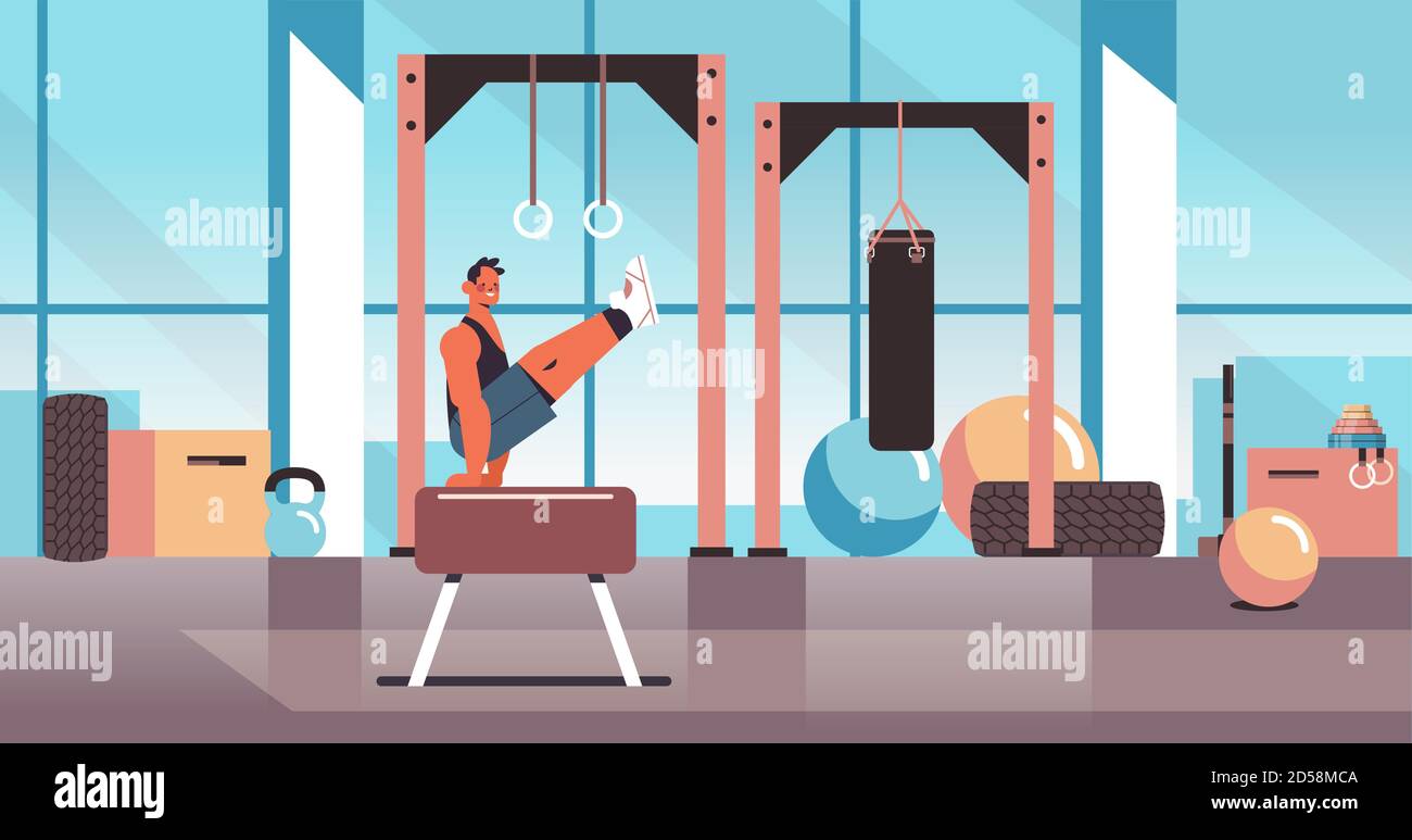 professional gymnast doing physical exercises on pommel horse working out fitness training